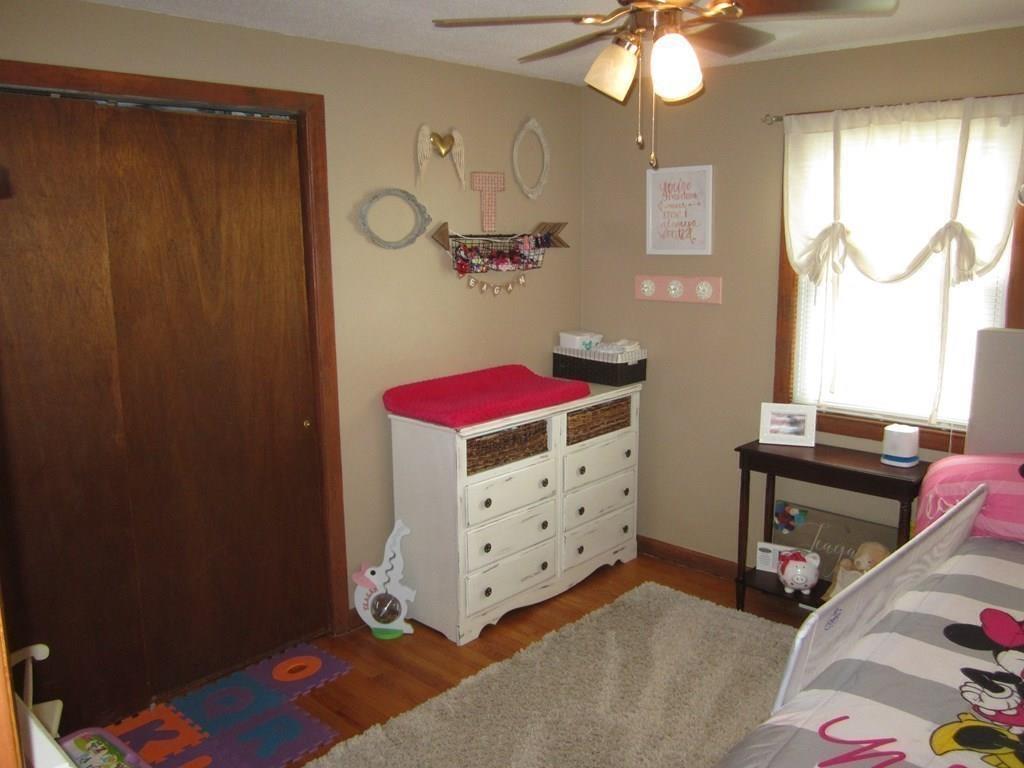 97 Fallston Street Springfield, MA 01119 - Photo 22 of 35 a bedroom with a bed and a dresser