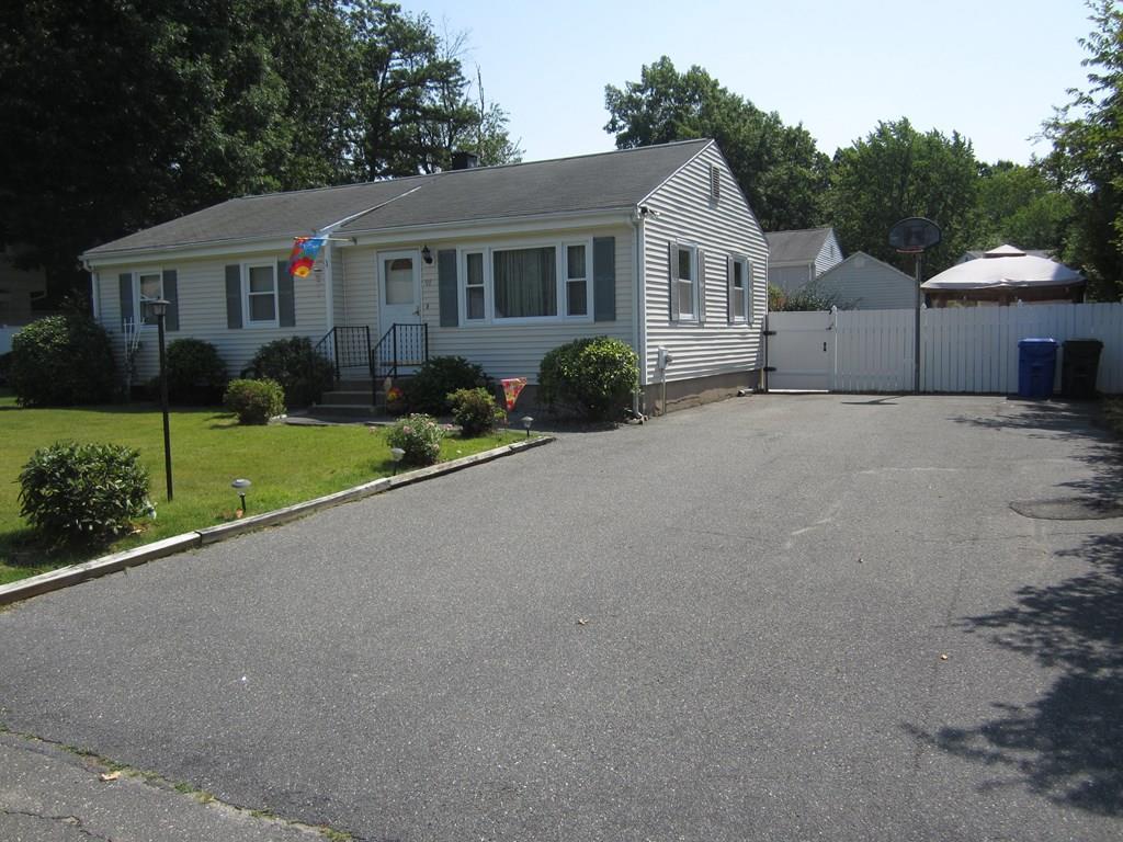 97 Fallston Street Springfield, MA 01119 - Photo 35 of 35 a front view of a house with a yard and garage