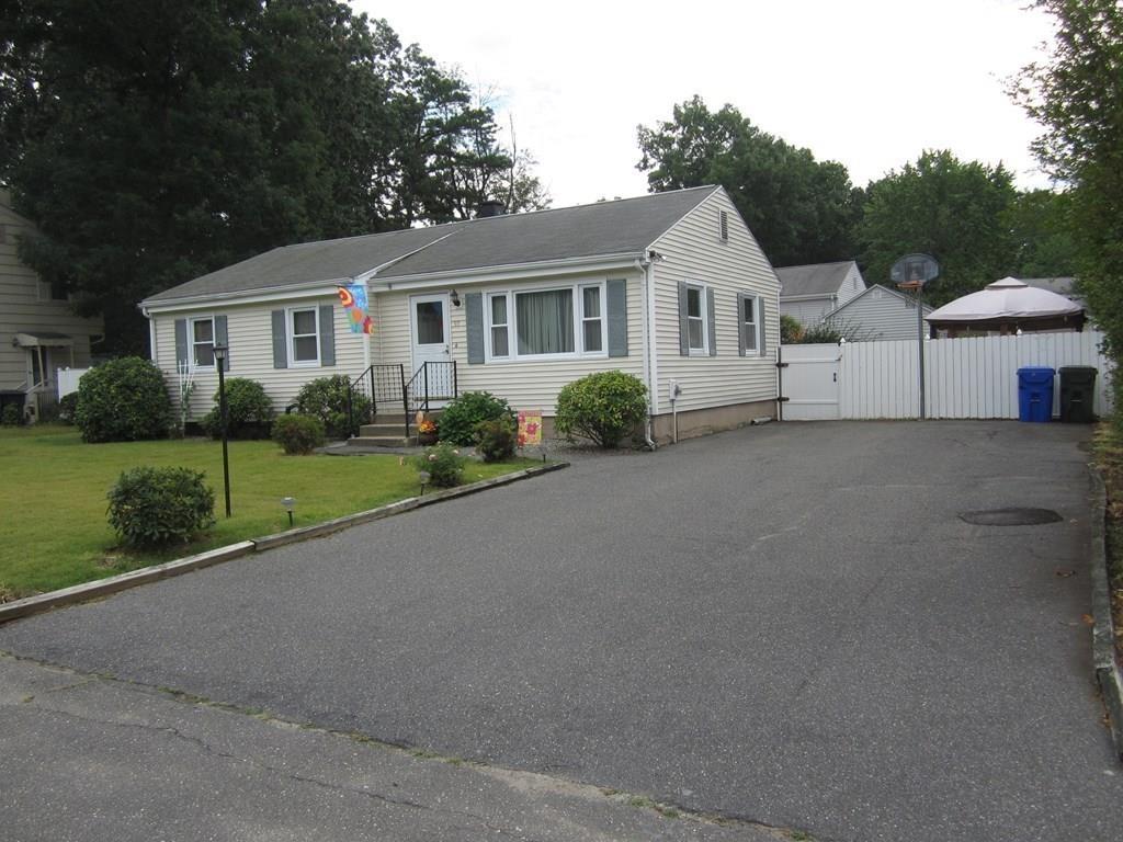 97 Fallston Street Springfield, MA 01119 - Photo 5 of 35 a front view of a house with garden