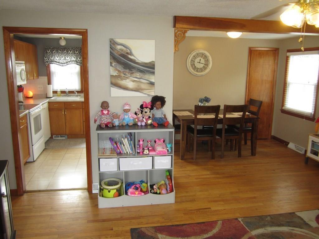 97 Fallston Street Springfield, MA 01119 - Photo 10 of 35 a view of a dining area with furniture window and wooden floor