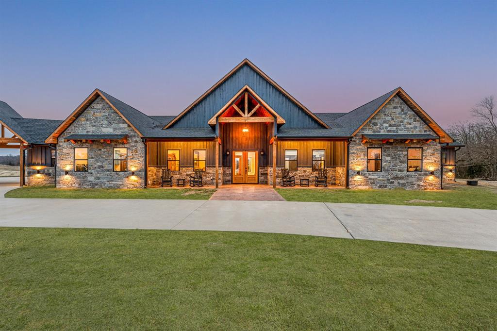 239 32507th Road Paris, TX 75460 - Photo 5 of 40 Craftsman-style home with a porch, stone siding, and a front lawn
