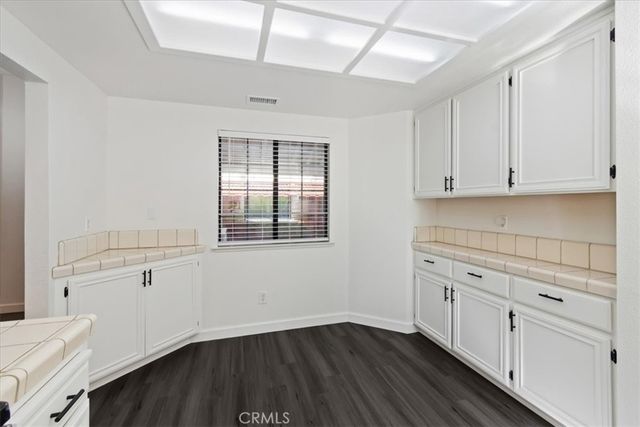 a view of cabinets and wooden floor