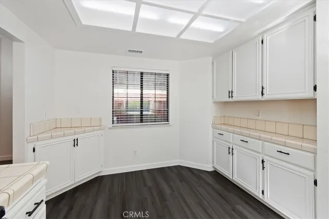 a view of cabinets and wooden floor