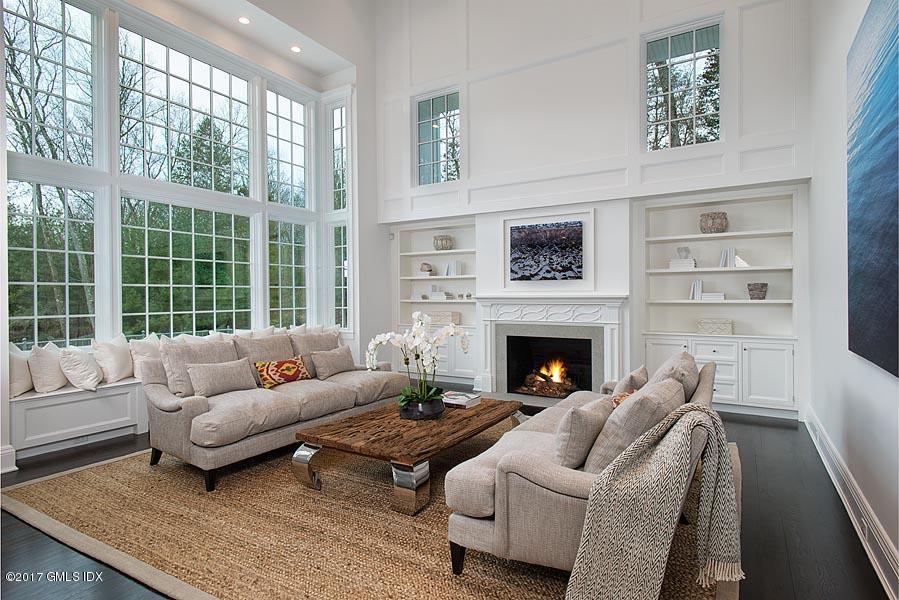 1 Doverton Drive Greenwich, CT 06831 - Photo 16 of 34 a living room with furniture large window and a fireplace