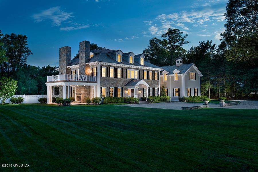 1 Doverton Drive Greenwich, CT 06831 - Photo 2 of 34 a front view of a house with a garden