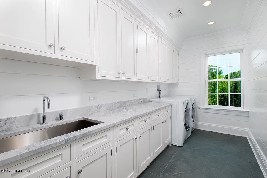 1 Doverton Drive Greenwich, CT 06831 - Photo 26 of 34 a kitchen with granite countertop white cabinets and a sink