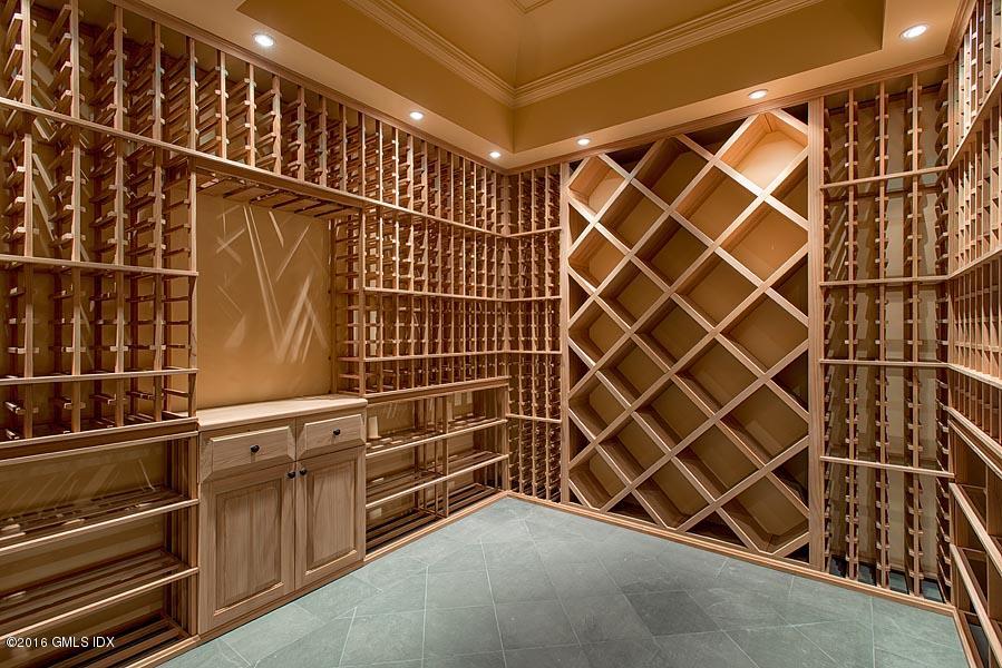 1 Doverton Drive Greenwich, CT 06831 - Photo 31 of 34 a view of an empty room with wooden shelves