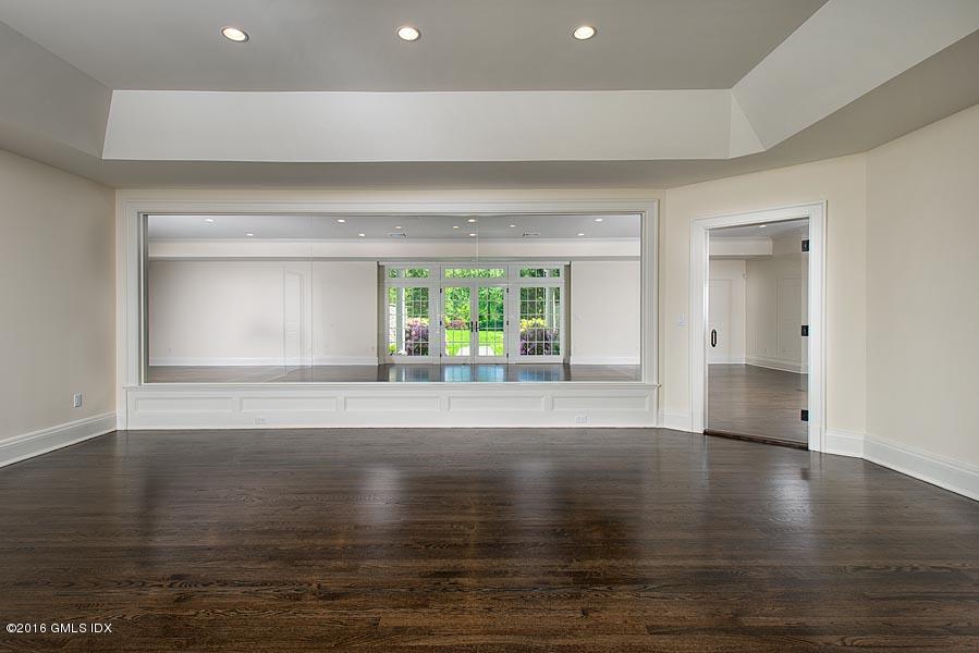 1 Doverton Drive Greenwich, CT 06831 - Photo 32 of 34 a view of an empty room with wooden floor and a window