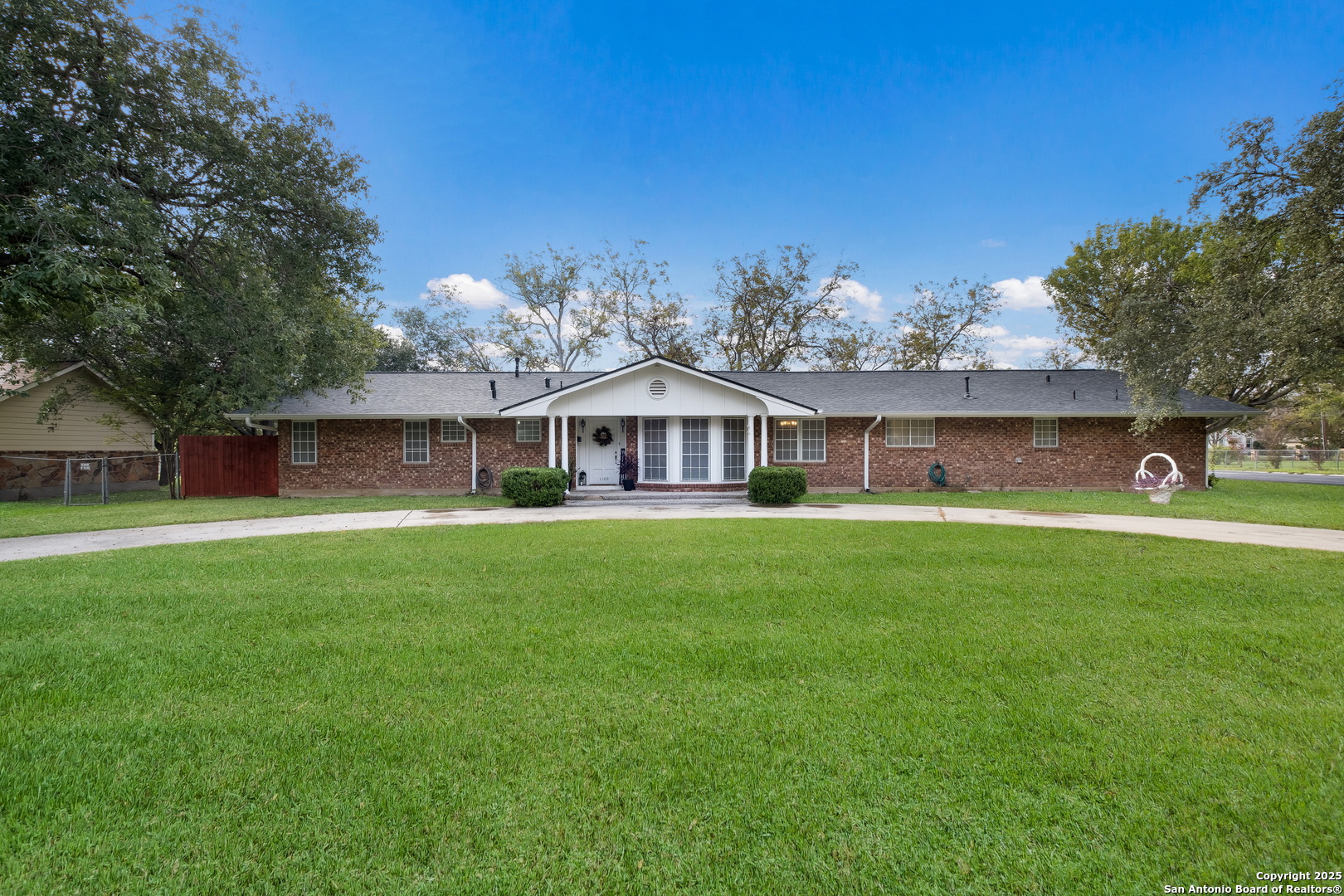 a front view of house with yard and seating area