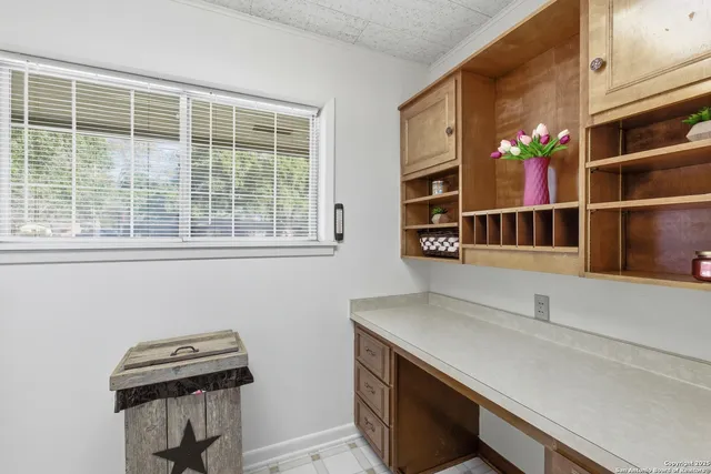 a bathroom with a sink and a window