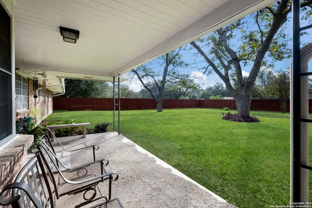 a view of yard with furniture and garden
