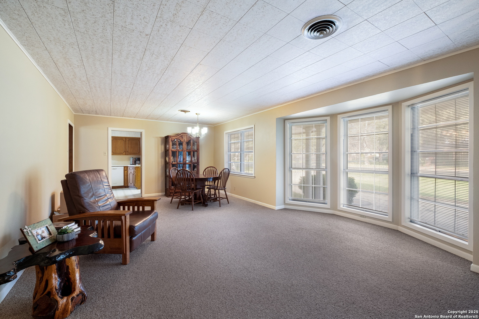 1109 27th Street Hondo, TX 78861 - Photo 8 of 21 a view of a livingroom with lounge chair and a large window