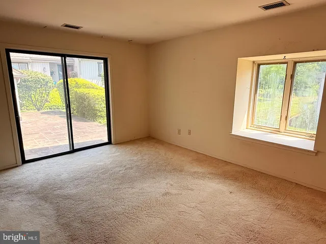 an empty room with windows