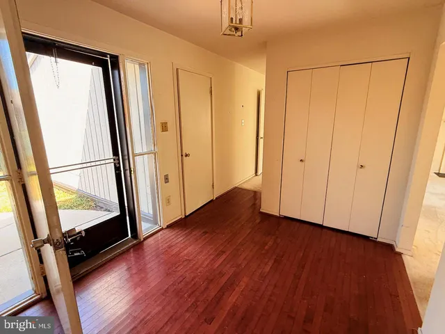 a view of front door with wooden floor