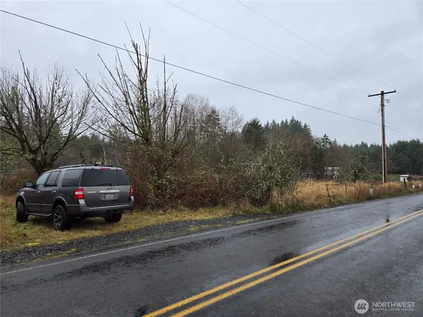 a view of a road with a yard