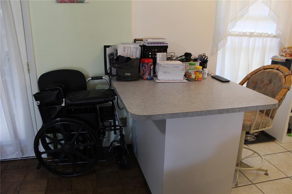 2755 Taylor Road Auburndale, FL 33823 - Photo 68 of 86 a view of a workspace with furniture and a window