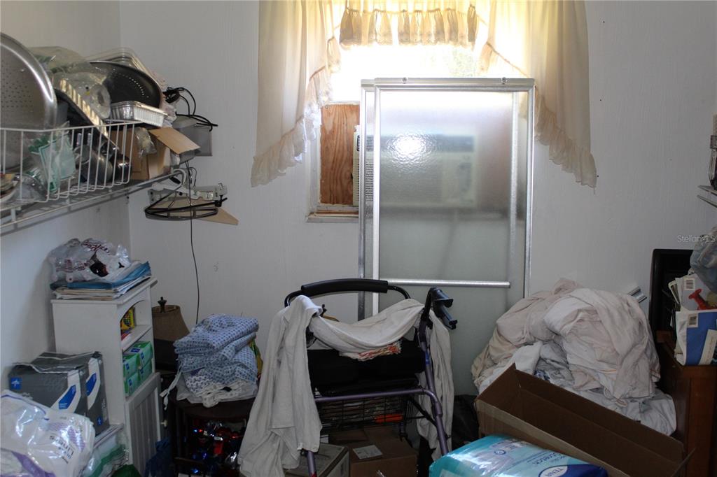 2755 Taylor Road Auburndale, FL 33823 - Photo 80 of 86 a bedroom with a bed and cabinets