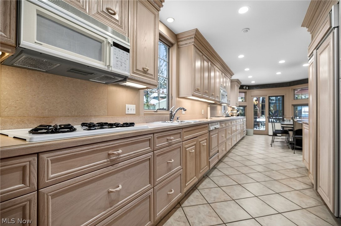 3498 Bainbridge Road Cleveland Heights, OH 44118 - Photo 14 of 50 Kitchen featuring white appliances, light countertops, recessed lighting, light tile patterned floors, and light brown cabinetry