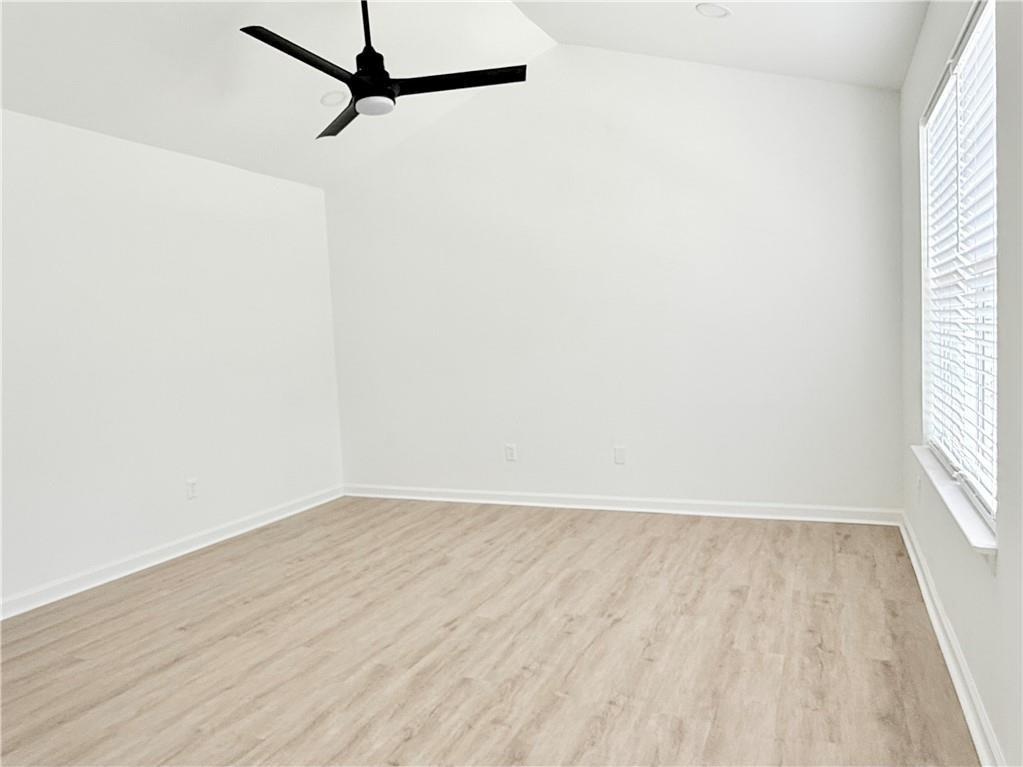 900 Melrose Park Place Lawrenceville, GA 30044 - Photo 12 of 26 a view of a room with wooden floor and a window
