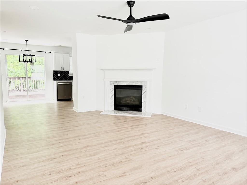 900 Melrose Park Place Lawrenceville, GA 30044 - Photo 2 of 26 a view of a kitchen with an empty room and fire place