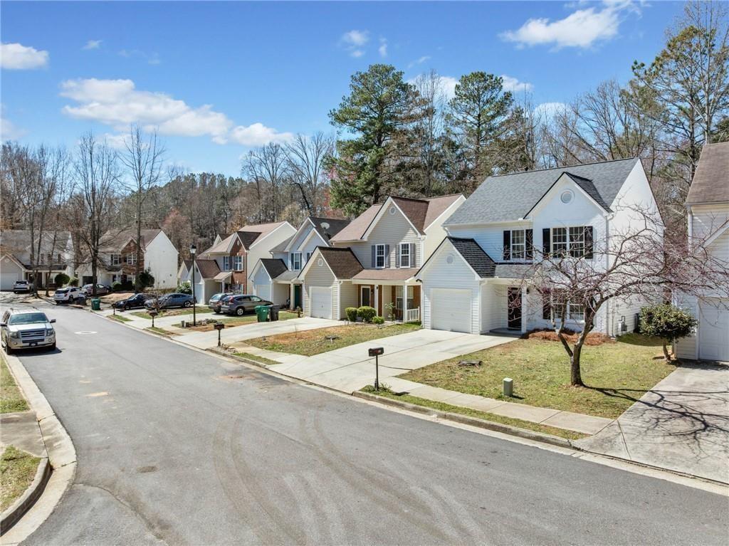 900 Melrose Park Place Lawrenceville, GA 30044 - Photo 25 of 26 a view of a house with a swimming pool