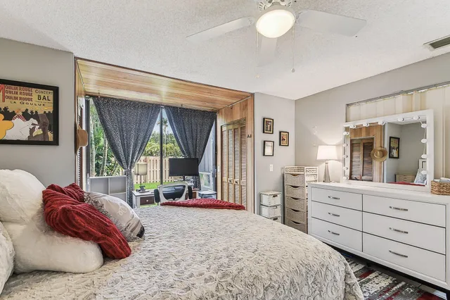 a view of balcony with furniture and a potted plant