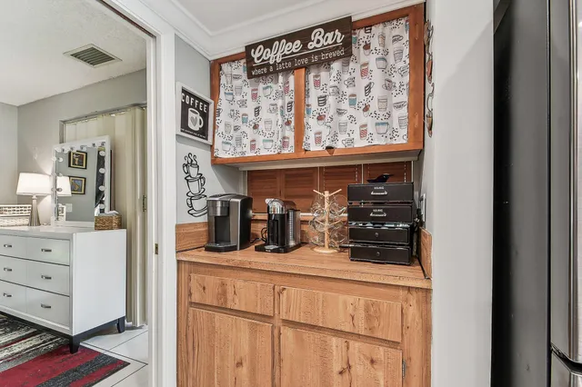 a living room with furniture and large windows