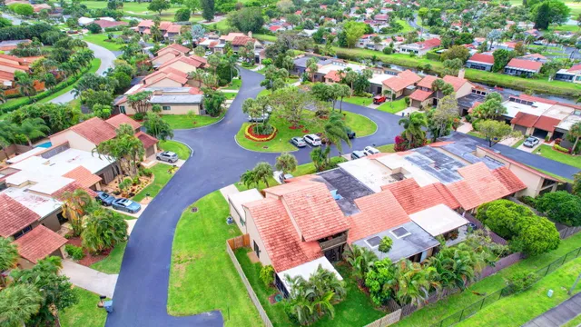 an aerial view of a house with yard swimming pool and outdoor seating