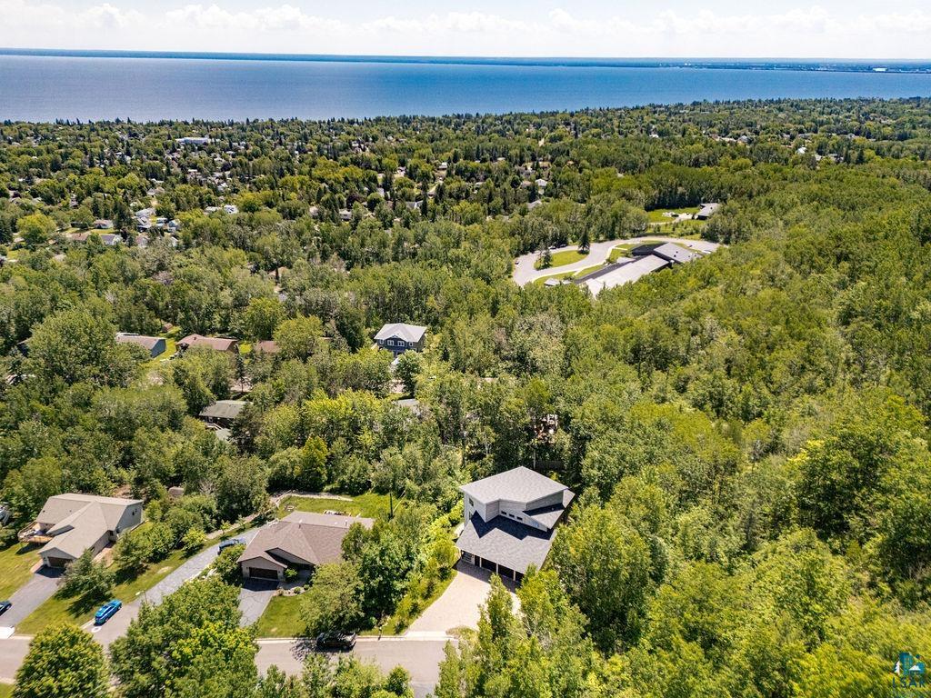4856 Kingston Street Duluth, MN 55804 - Photo 82 of 88 Aerial perspective showcasing a contemporary home nestled among extensive mature trees