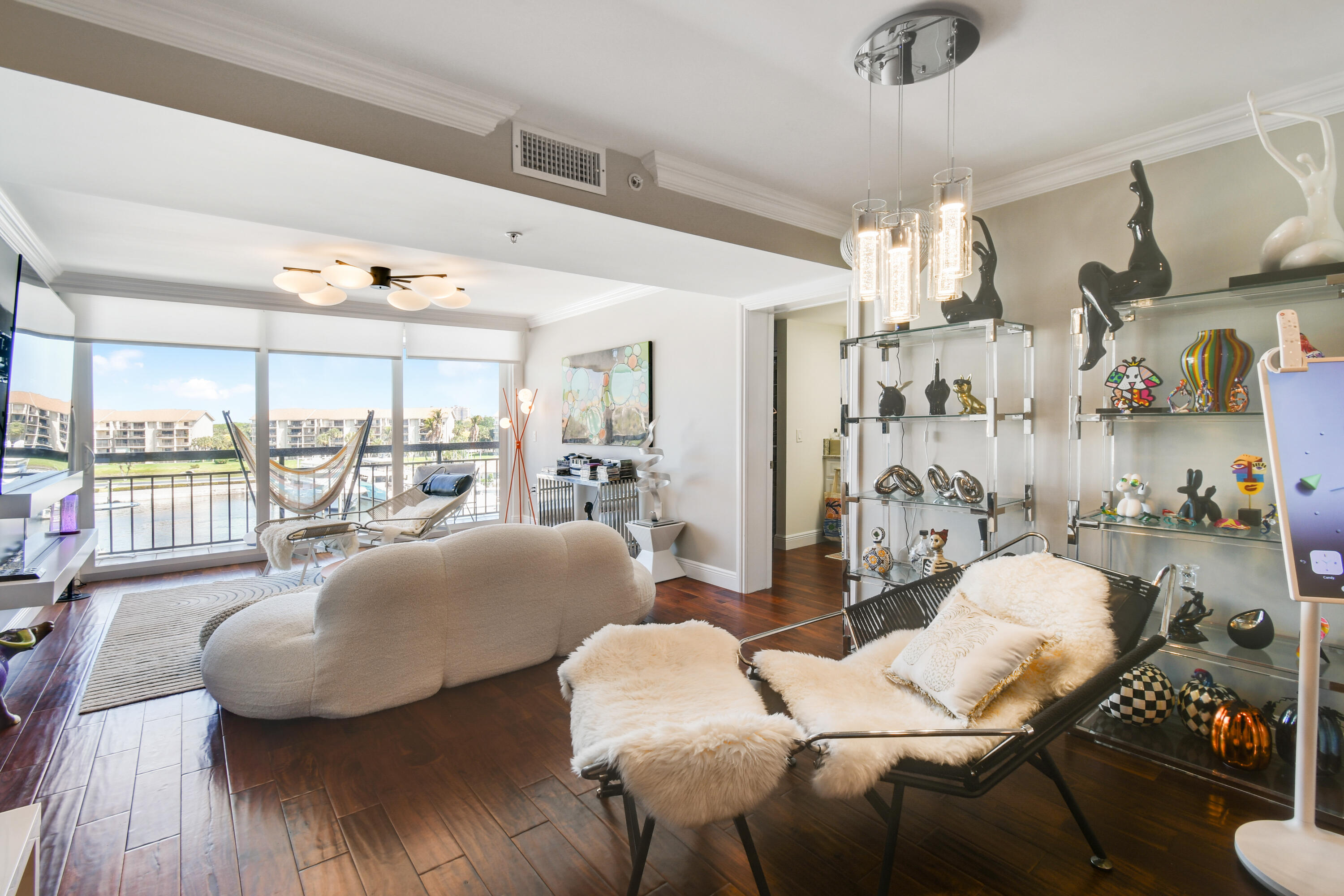 2401 Marina Isle Way, Unit 503 Jupiter, FL 33477 - Photo 15 of 46 a living room with furniture and a large window
