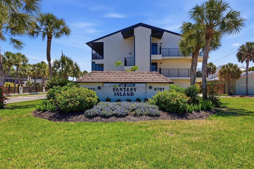 2729 North Beach Road, Unit 211 Englewood, FL 34223 - Photo 8 of 51 a house view with a garden space