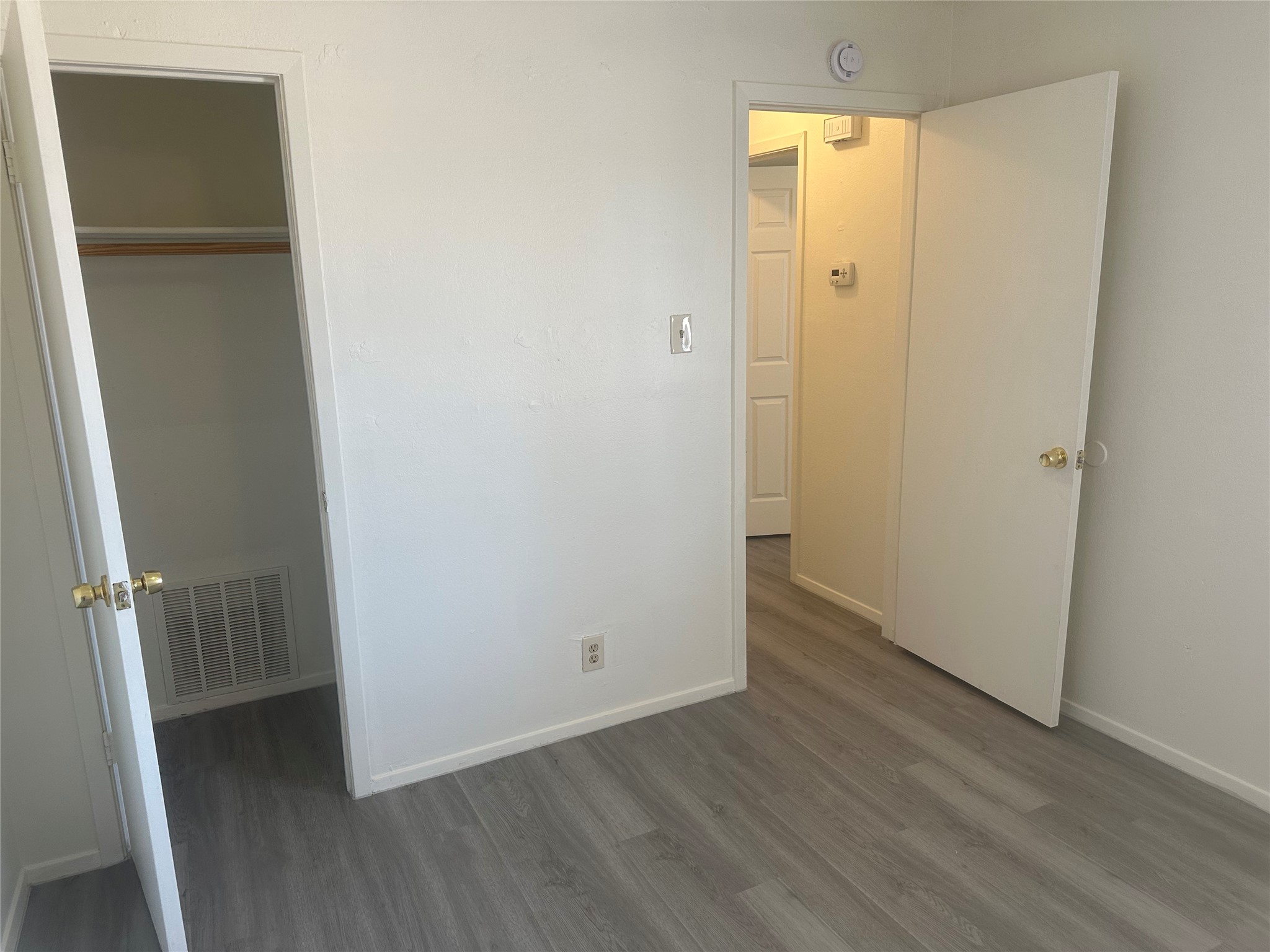 2602 South Bagdad Road, Unit B Leander, TX 78641 - Photo 15 of 23 Smooth vinyl plank flooring pairs with clean white walls to create a versatile canvas.