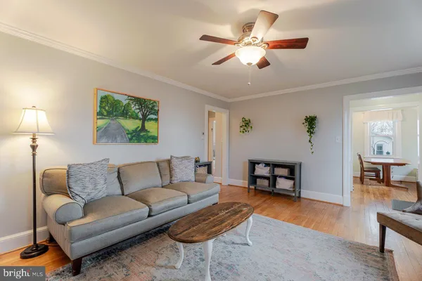 a bathroom with a toilet a sink and a mirror