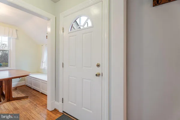 a view of a dining room with furniture and windows