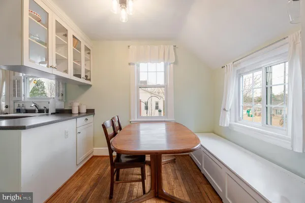 a kitchen with stainless steel appliances a stove a sink and a microwave