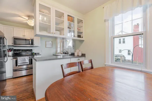 a kitchen with cabinets and steel stainless steel appliances
