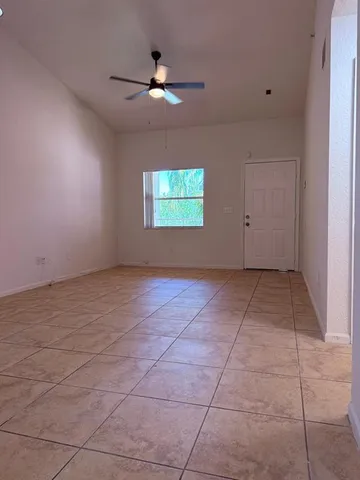 a view of an empty room with windows