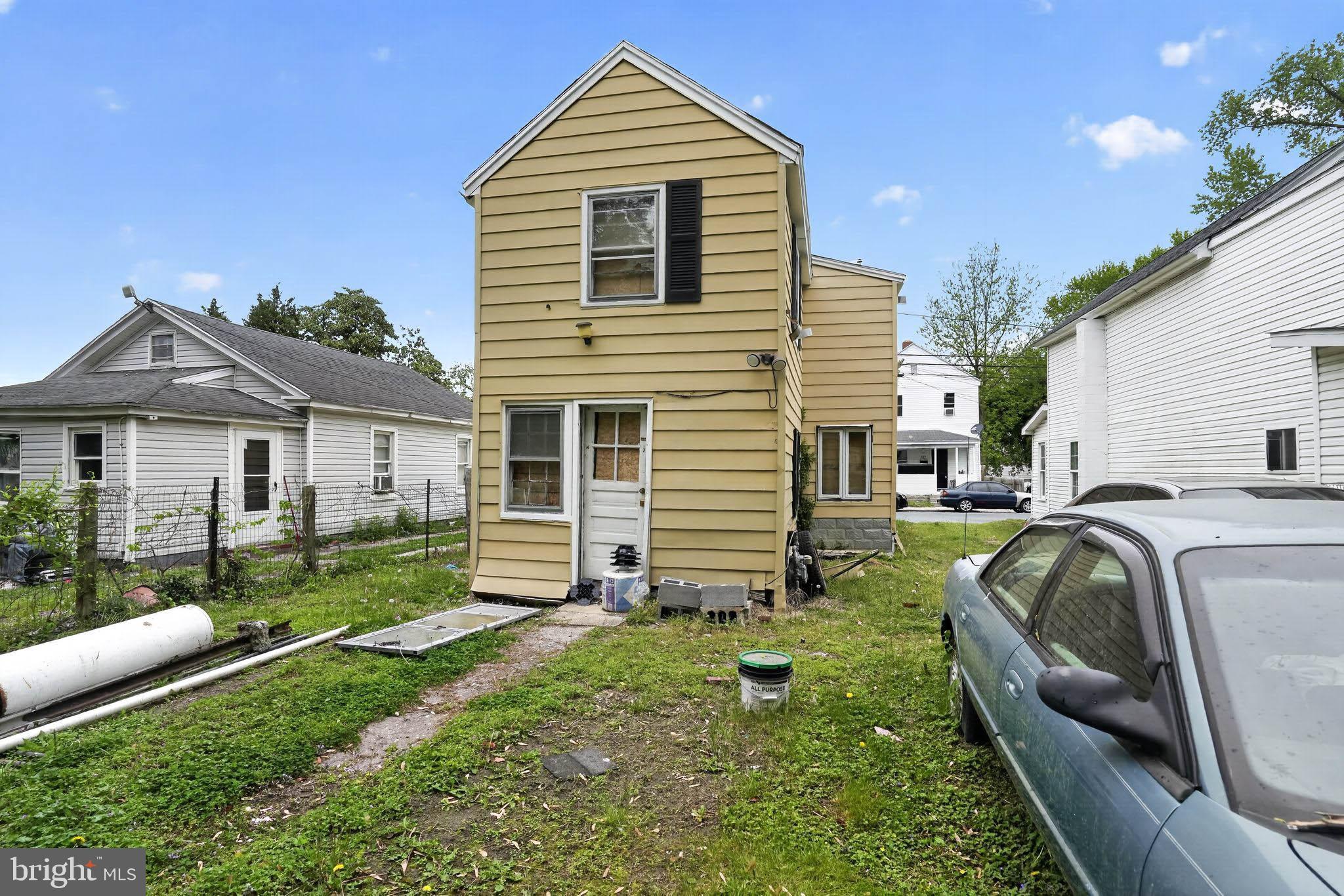 626 Douglas Street Cambridge, MD 21613 - Photo 13 of 15 a front view of a house with a yard