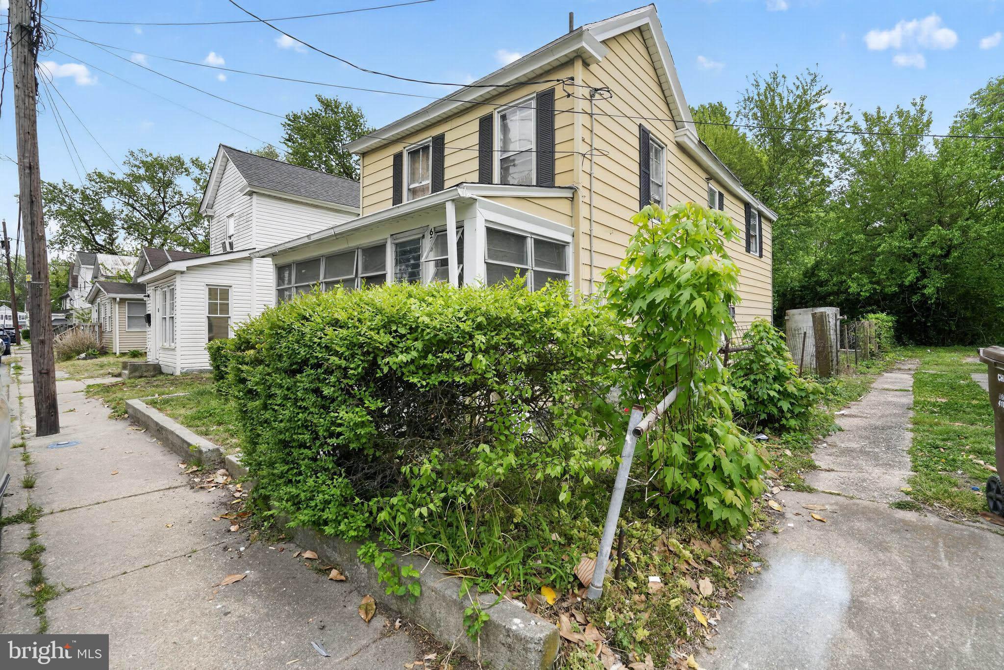 626 Douglas Street Cambridge, MD 21613 - Photo 15 of 15 a front view of a house with a garden