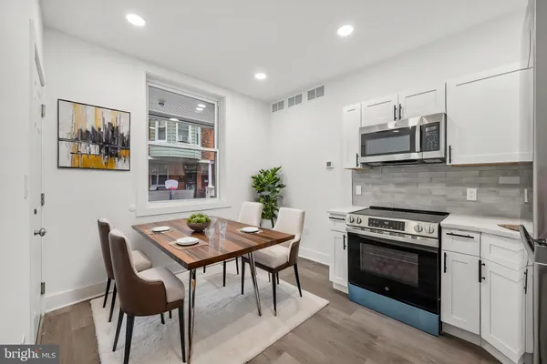 a kitchen with a stove and a refrigerator