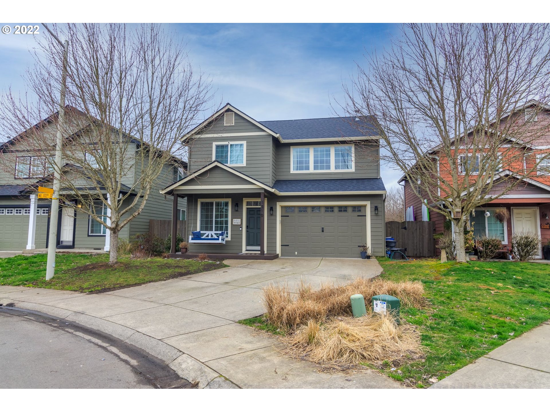 1310 Northeast 172nd Street Ridgefield, WA 98642 - Photo 1 of 32 a front view of a house with a yard