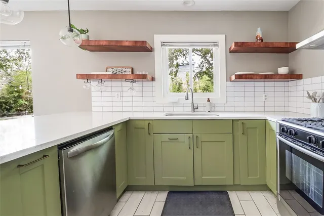 a kitchen with a sink and wooden cabinets