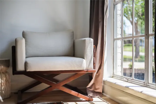 a view of a room with furniture and a window