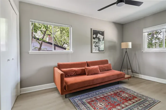 a living room with furniture and a rug