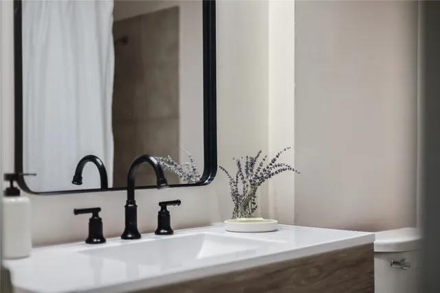 a bathroom with a sink and mirror