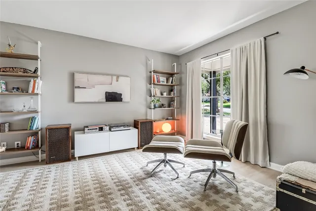 a living room with furniture and a window