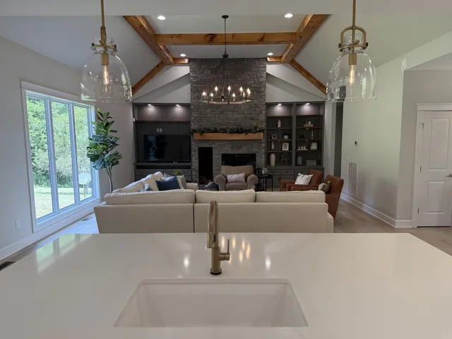 a view of a dining room with furniture wooden floor and chandelier