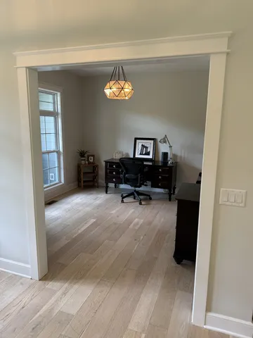 a bathroom with double vanity and a mirror