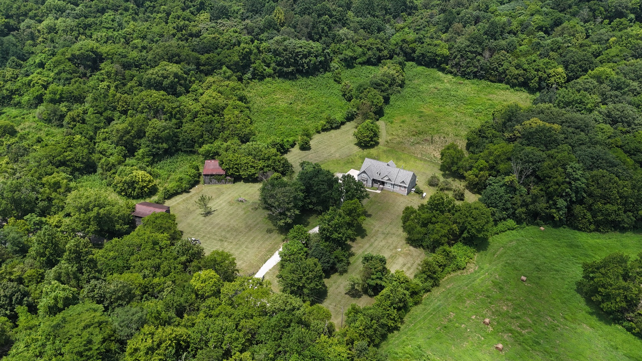 2145 Honey Prong Road Hartsville, TN 37074 - Photo 3 of 99 an aerial view of residential houses with outdoor space and trees all around