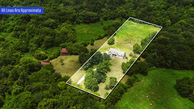 a view of a house with a small yard